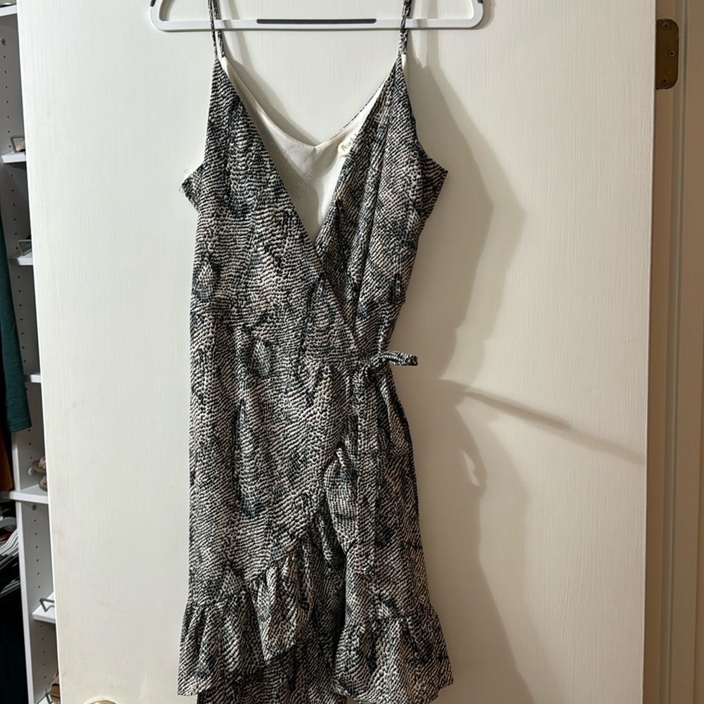 This has wrap dress has never been worn but the tags have been removed.